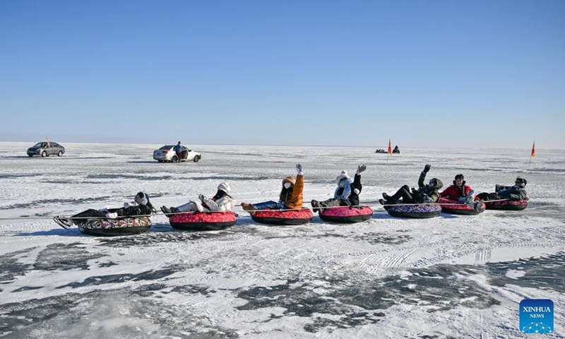 Taiwan students play ice drifting on Chagan Lake in Songyuan, northeast China's Jilin Province, on Jan. 24, 2024. (Xinhua/Chen Yehua)
