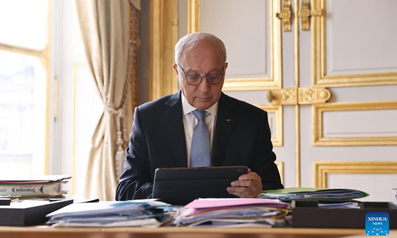Laurent Fabius, president of the Constitutional Council and former French prime minister, works in Paris, France, Dec. 12, 2023. (Xinhua/Gao Jing)