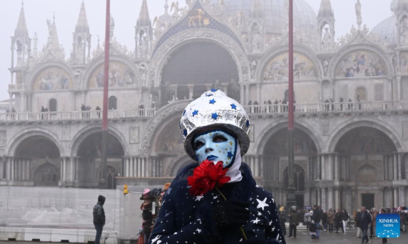 A masked participant poses for photos during the carnival in Venice, Italy, Jan. 27, 2024. (Photo by Alberto Lingria/Xinhua)