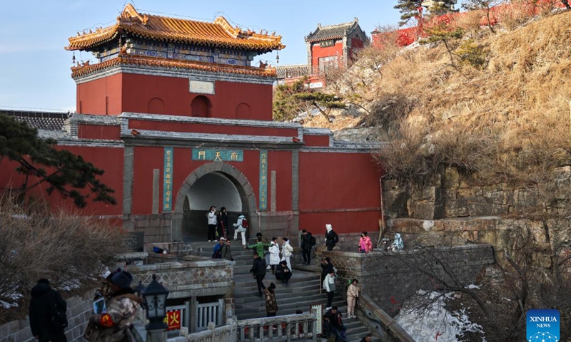 Tourists visit the Mount Tai scenic area in east China's Shandong Province, Jan. 26, 2024. With its natural and cultural values well interconnected, Mount Tai was listed as a World Cultural and Natural Heritage site by UNESCO in 1987, the first ever in China. In 2023, the Mount Tai scenic area received over 8.61 million visitors, a new record over the years. (Xinhua/Zhu Zheng)
