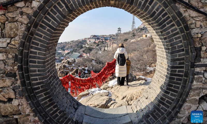 Tourists visit the Mount Tai scenic area in east China's Shandong Province, Jan. 26, 2024. With its natural and cultural values well interconnected, Mount Tai was listed as a World Cultural and Natural Heritage site by UNESCO in 1987, the first ever in China. In 2023, the Mount Tai scenic area received over 8.61 million visitors, a new record over the years. (Xinhua/Zhu Zheng)