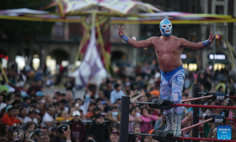A wrestler participates in a wrestling show at the Zocalo Square in Mexico City, Mexico on Jan. 26, 2024. (Photo by Francisco Canedo/Xinhua)