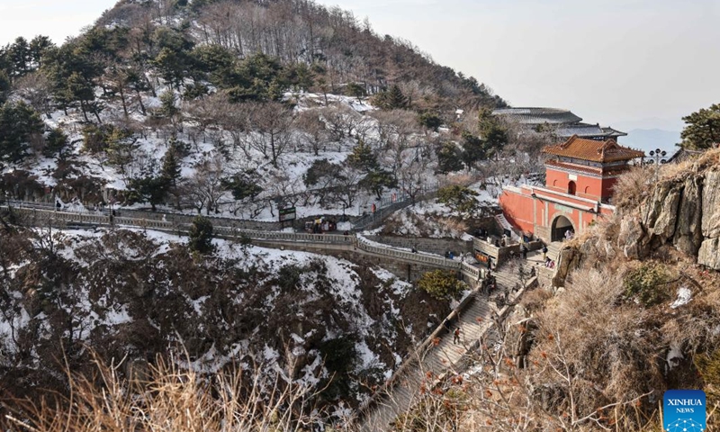 Tourists visit the Mount Tai scenic area in east China's Shandong Province, Jan. 26, 2024. With its natural and cultural values well interconnected, Mount Tai was listed as a World Cultural and Natural Heritage site by UNESCO in 1987, the first ever in China. In 2023, the Mount Tai scenic area received over 8.61 million visitors, a new record over the years. (Xinhua/Zhu Zheng)