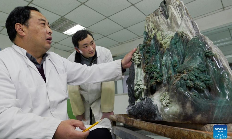 Liu Xiaoqiang (L) instructs an apprentice at his studio in Zhenping County of Nanyang City, central China's Henan Province, Jan. 23, 2024.(Xinhua/Li Jianan)