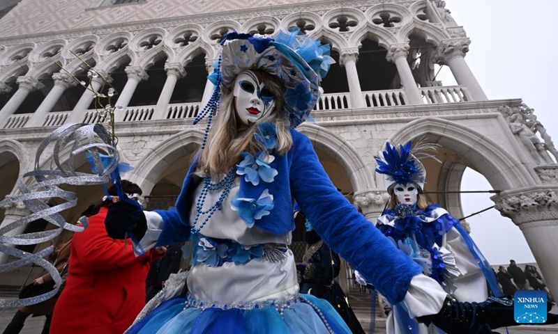 Masked people pose for photos during the carnival in Venice, Italy, Jan. 27, 2024. (Photo by Alberto Lingria/Xinhua)