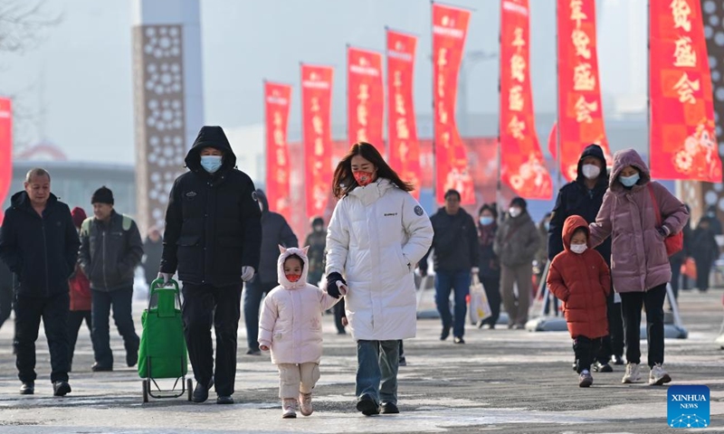 People visit a fair in preparation for the upcoming Spring Festival at the Xinjiang International Convention and Exhibition Center in Urumqi, northwest China's Xinjiang Uygur Autonomous Region, Jan. 27, 2024. (Xinhua/Ding Lei)