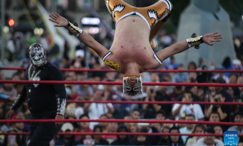 A wrestler participates in a wrestling show at the Zocalo Square in Mexico City, Mexico on Jan. 26, 2024. (Photo by Francisco Canedo/Xinhua)