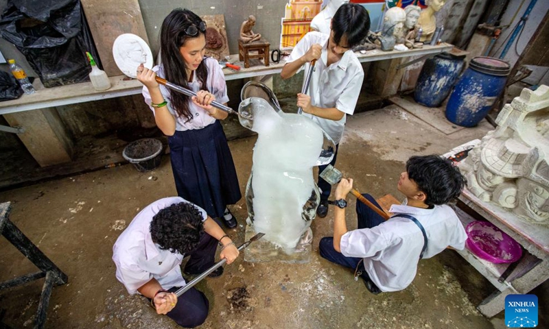Students of Saowabha Vocational College carve an ice sculpture in Bangkok, Thailand, Jan. 22, 2024.(Xinhua/Wang Teng)