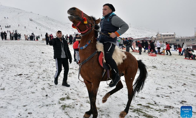 A man rides a horse at a snow resort in Ankara, Türkiye, Jan. 28, 2024. (Photo by Mustafa Kaya/Xinhua)