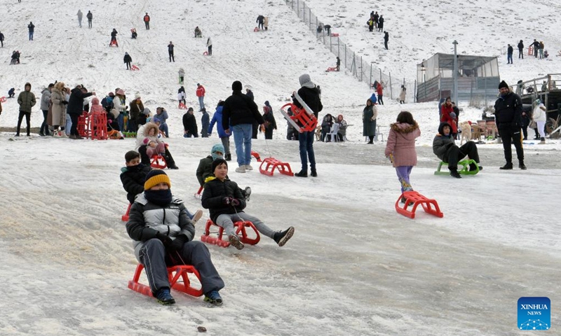 People have fun at a snow resort in Ankara, Türkiye, Jan. 28, 2024. (Photo by Mustafa Kaya/Xinhua)
