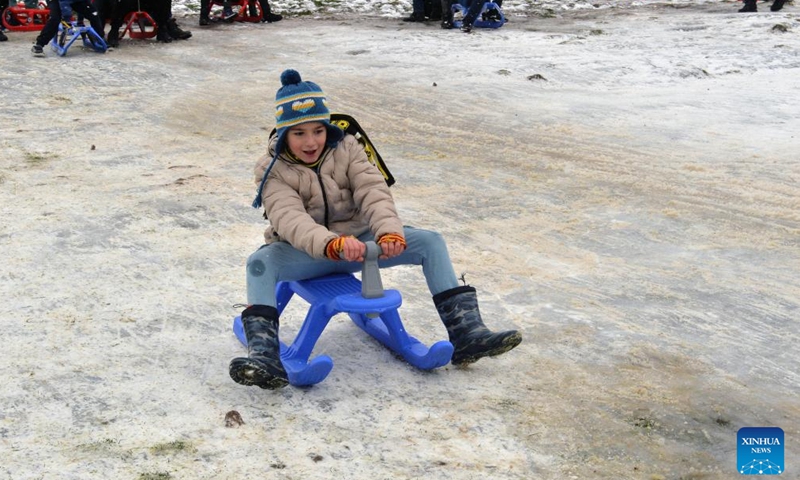 A boy plays at a snow resort in Ankara, Türkiye, Jan. 28, 2024. (Photo by Mustafa Kaya/Xinhua)