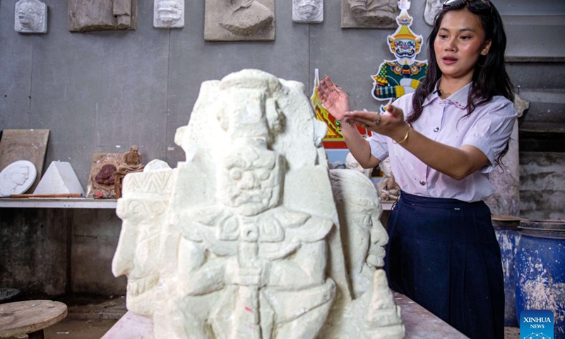 Sudakan Jardkaew introduces the model of the winning sculpture titled Tuk Tuk on Tour in Bangkok, Thailand, Jan. 22, 2024.(Xinhua/Wang Teng)