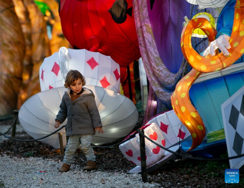 A boy looks at a lantern during the International Lantern Festival Lanternia in Cassino, central Italy, Jan. 28, 2024. More than 300 Chinese lanterns made by artisans from Zigong, a southwest China's city famous for its lantern making, are exhibited here. Since its opening on Dec. 8, 2023, the lantern show has attracted approximately 80,000 visitors(Photo: Xinhua)