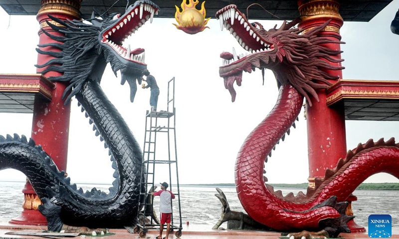 Workers repaint dragon statues in preparation for the upcoming Chinese Lunar New Year of the Dragon at a temple in Surabaya, East Java, Indonesia, on Jan. 29, 2024.(Photo: Xinhua)