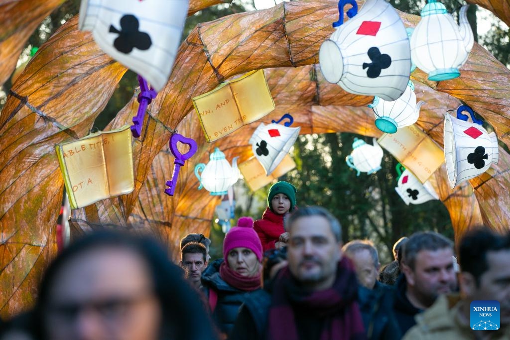 Visitors walk past lanterns during the International Lantern Festival Lanternia in Cassino, central Italy, Jan. 28, 2024. More than 300 Chinese lanterns made by artisans from Zigong, a southwest China's city famous for its lantern making, are exhibited here. Since its opening on Dec. 8, 2023, the lantern show has attracted approximately 80,000 visitors.(Photo: Xinhua)
