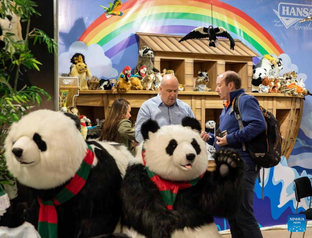 People talk behind panda models at the Nuremberg International Toy Fair (Spielwarenmesse) in Nuremberg, Germany, Jan. 30, 2024. As a leading trade fair for toys, hobbies and leisure, the Spielwarenmesse kicked off here on Tuesday with over 2,100 participating companies from around the world.(Photo: Xinhua)