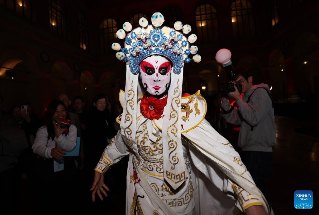 An artist performs face changing during a tourism promotion event named Nihao! China at the Paris Brongniart in Paris, France, Jan. 30, 2024.(Photo: Xinhua)