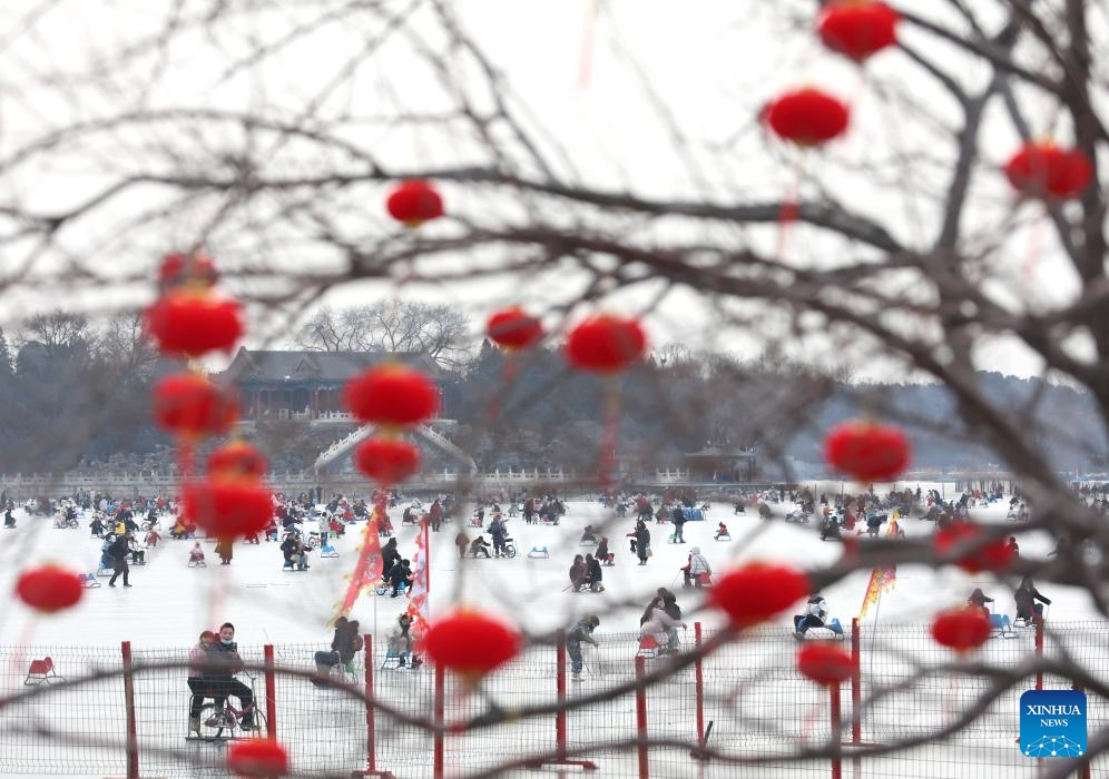 People have fun on the frozen Kunming Lake at the Summer Palace in Beijing, capital of China, Feb. 2, 2024.(Photo: Xinhua)