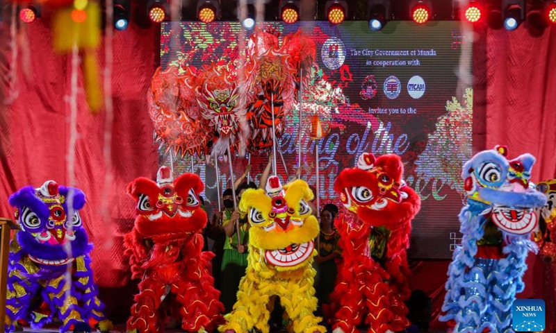 Dragon and lion dancers perform during the ceremonial lighting of the prosperity tree to celebrate the upcoming Chinese Lunar New Year at Chinatown in Manila, the Philippines, on Feb. 1, 2024.(Photo: Xinhua)