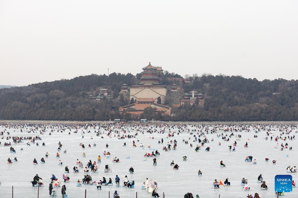 People have fun on the frozen Kunming Lake at the Summer Palace in Beijing, capital of China, Feb. 2, 2024.(Photo: Xinhua)