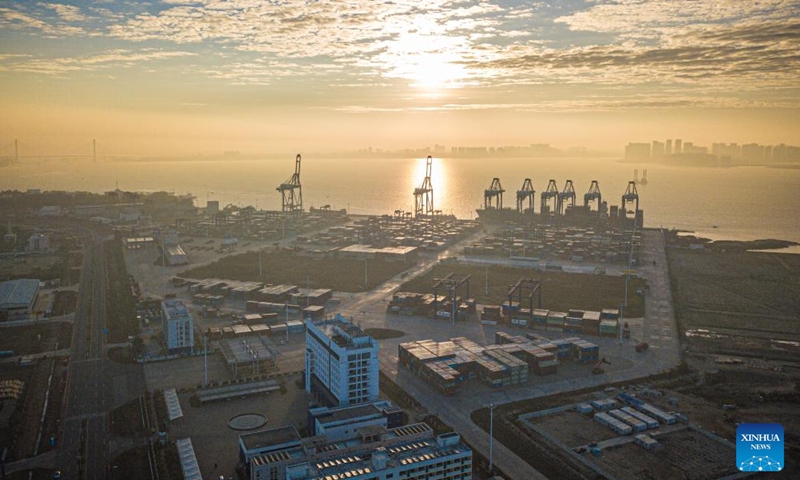 An aerial drone photo taken on Jan. 1, 2024 shows the Yangpu International Container Terminal in south China's Hainan Province. The key parks of Hainan Free Trade Port has achieved a revenue of around 2.24 trillion yuan (about 311.7 billion U.S. dollars) in 2023, an 18.3 percent increase year on year, according to data released by the Hainan Provincial Bureau of Statistics. (Xinhua/Pu Xiaoxu)