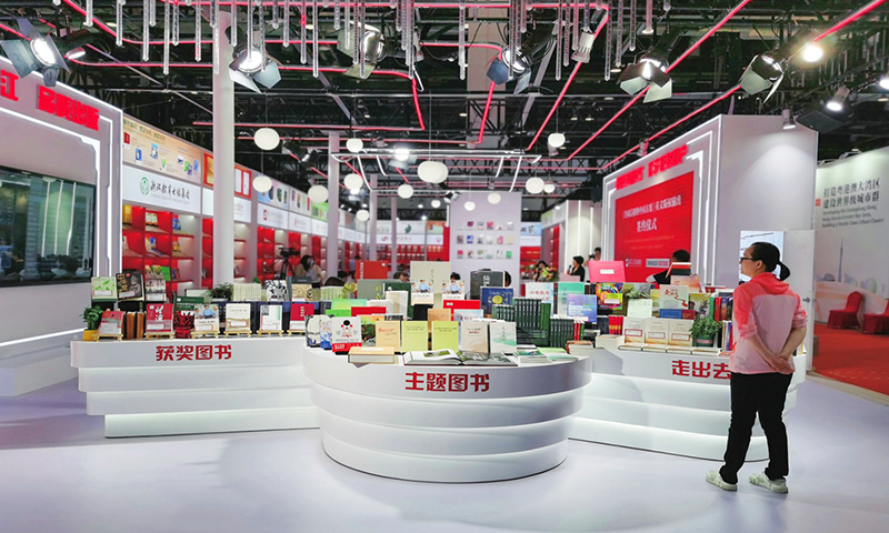 A visitor takes a look at the books at the 29th Beijing International Book Fair on June 16, 2023. Photos: VCG