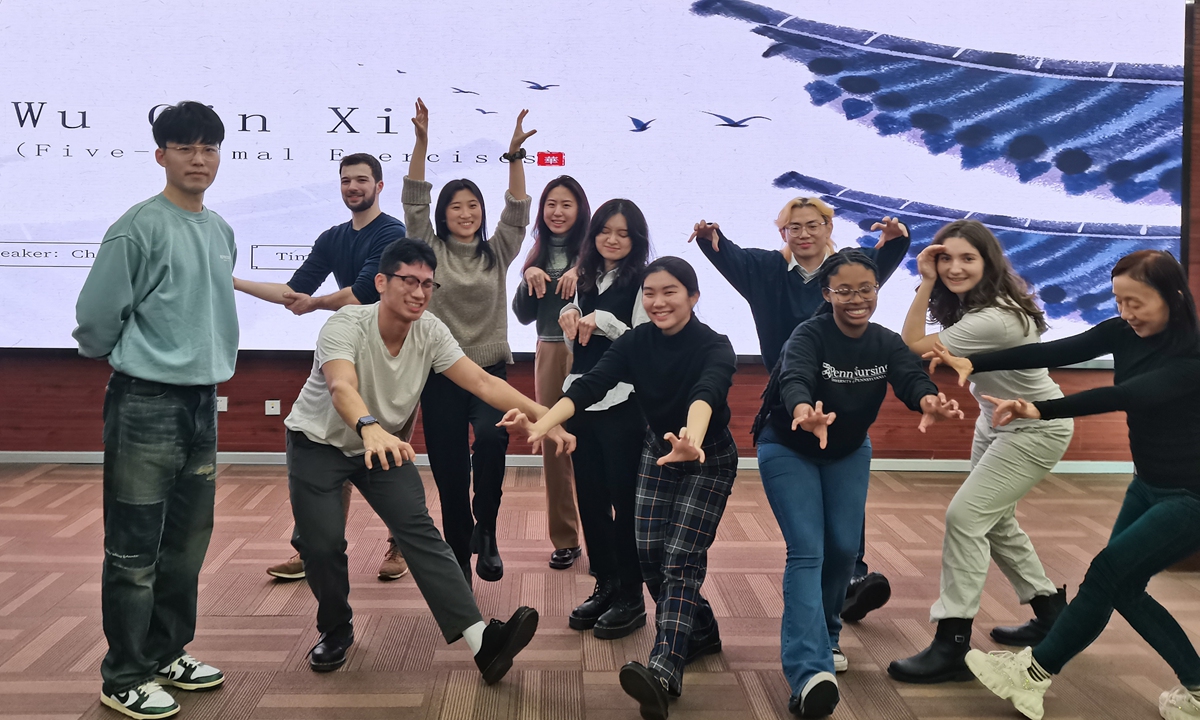 Teachers and students from the University of Pennsylvania experienced traditional Chinese fitness exercises Wu Qin Xi at the Shanghai University of Traditional Chinese Medicine (SHUTCM) in January 2024. Photo: Courtesy of SHUTCM

