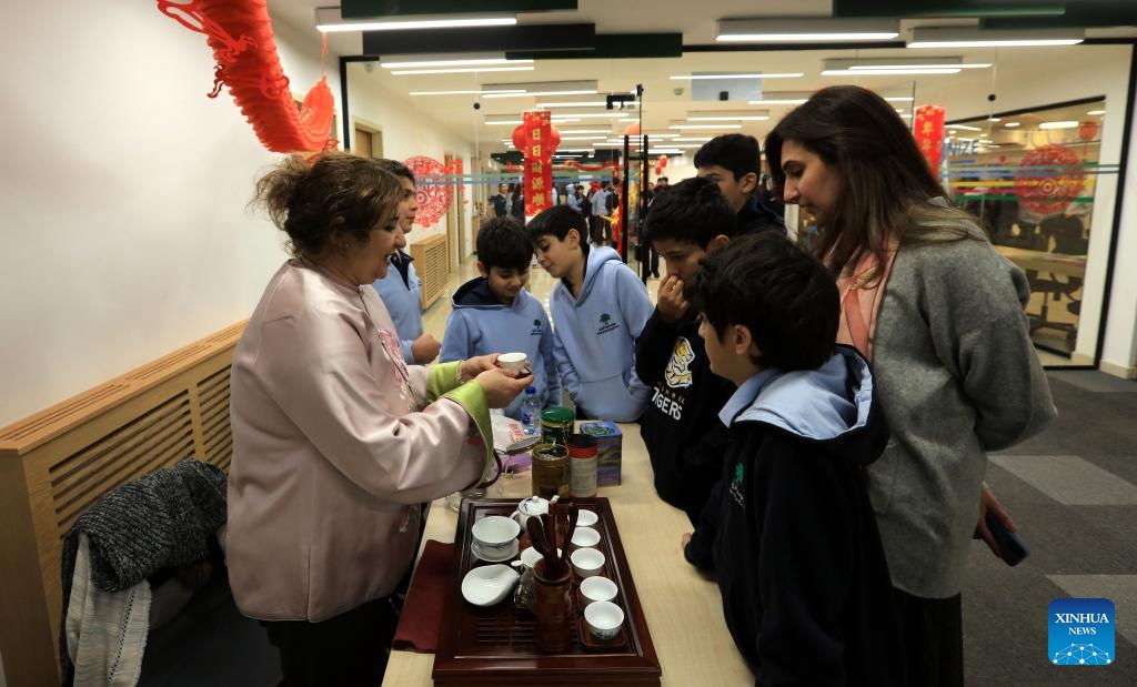 Students from a local school taste Chinese tea during a cultural event to celebrate the upcoming Chinese Lunar New Year in Amman, Jordan, Feb. 4, 2024.(Photo: Xinhua)