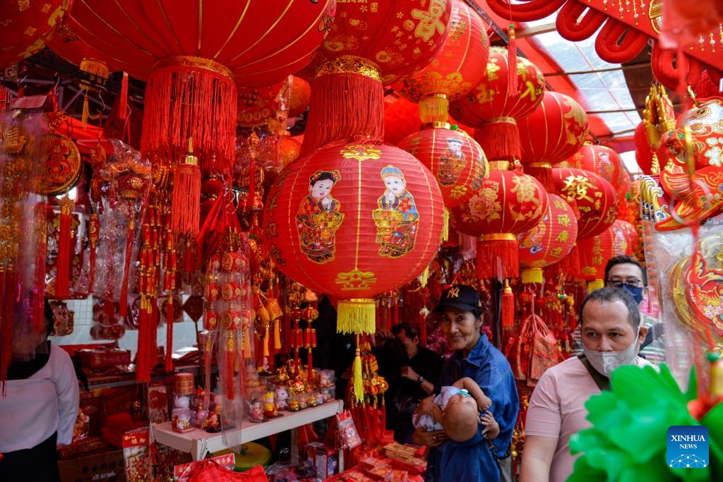 This photo taken on Feb. 4, 2024 shows a booth selling Spring Festival decorations at the Chinatown in Jakarta, Indonesia. As the Chinese Lunar New Year, or the Spring Festival, approaches, the festive atmosphere gradually permeates the air of the Chinatown and many business districts in Jakarta.(Photo: Xinhua)