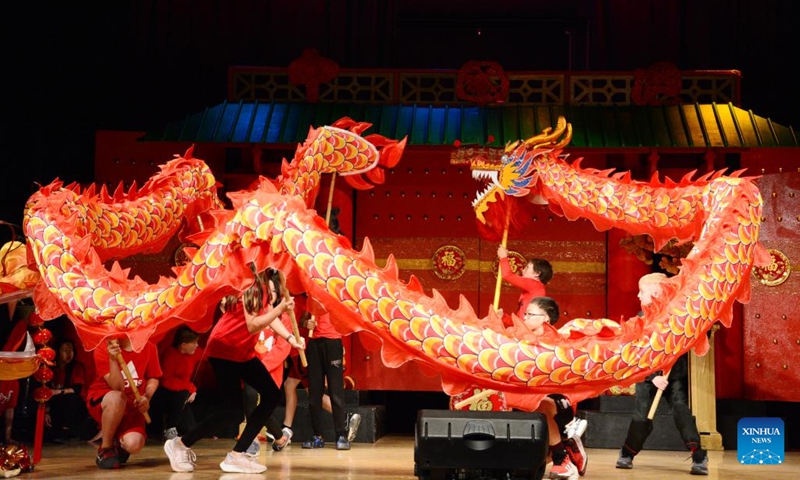 Local students in Phoenix perform Chinese dragon dance at the 34th Phoenix Chinese Week Culture and Cuisine Festival in Phoenix, Arizona, the United States, on Feb. 4, 2024. Over 20,000 local residents experienced the sights, sounds, and tastes of the 34th Phoenix Chinese Week Culture and Cuisine Festival this weekend in the capital city of Arizona.(Photo: Xinhua)