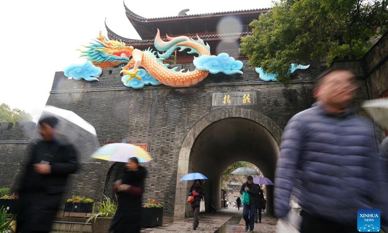 People visit the Drum Tower in Hangzhou, east China's Zhejiang Province, Feb. 6, 2024.(Photo: Xinhua)