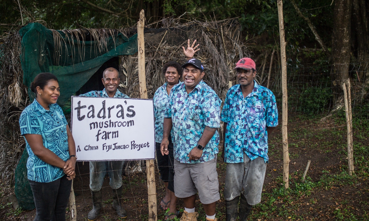 Local employees pose for a group photo at the Tadra's Mushroom Farm in Nadi, Fiji, on August 17, 2023. The farm cultivates mushrooms with China-aided Juncao technology. Photo: Shan Jie/GT