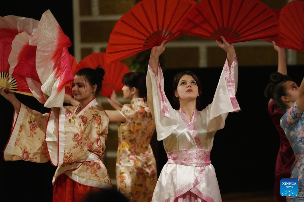 Local students perform Chinese dance during an event celebrating the upcoming Chinese Lunar New Year, or the Spring Festival, at the Confucius Institute of the University of Latvia in Riga, Latvia, Feb. 5, 2024.(Photo: Xinhua)
