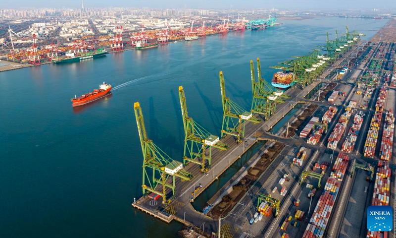 An aerial drone photo taken on Feb 2, 2024 shows a cargo ship sailing in the main channel of Tianjin Port in north China's Tianjin. Tianjin Port, located on the coast of the Bohai Sea, is a major shipping point in north China. Photo: Xinhua