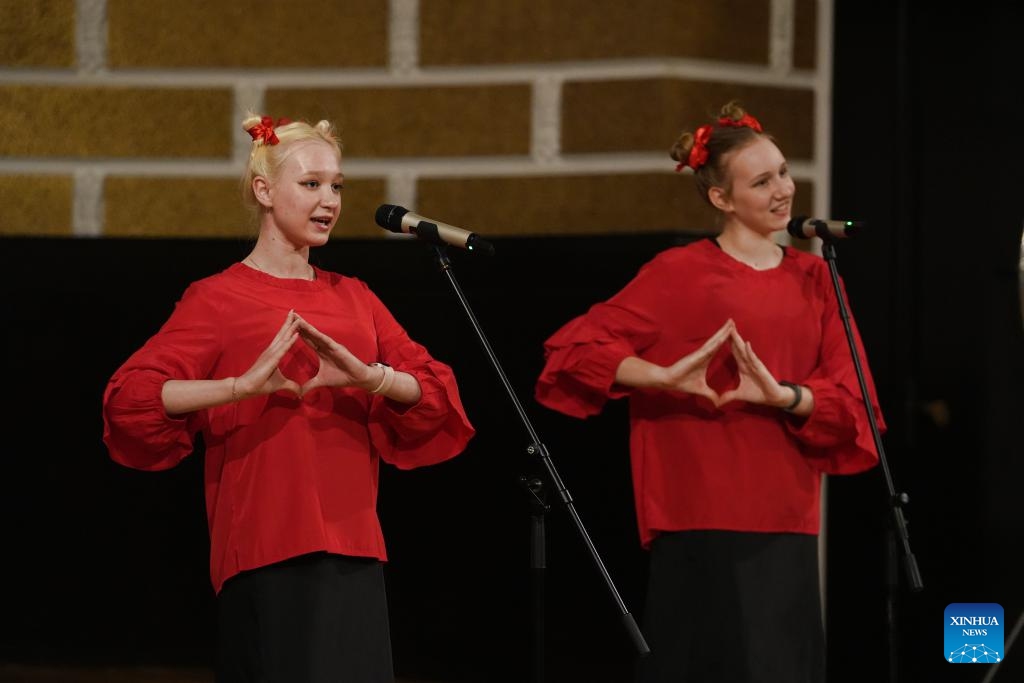 Local students sing during an event celebrating the upcoming Chinese Lunar New Year, or the Spring Festival, at the Confucius Institute of the University of Latvia in Riga, Latvia, Feb. 5, 2024.(Photo: Xinhua)