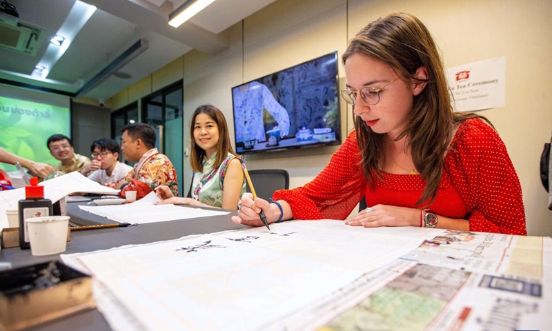 Students write Chinese calligraphy during an event celebrating the upcoming Chinese Lunar New Year, or the Spring Festival, at Thammasat University in Bangkok, Thailand, Feb. 5, 2024.(Photo: Xinhua)