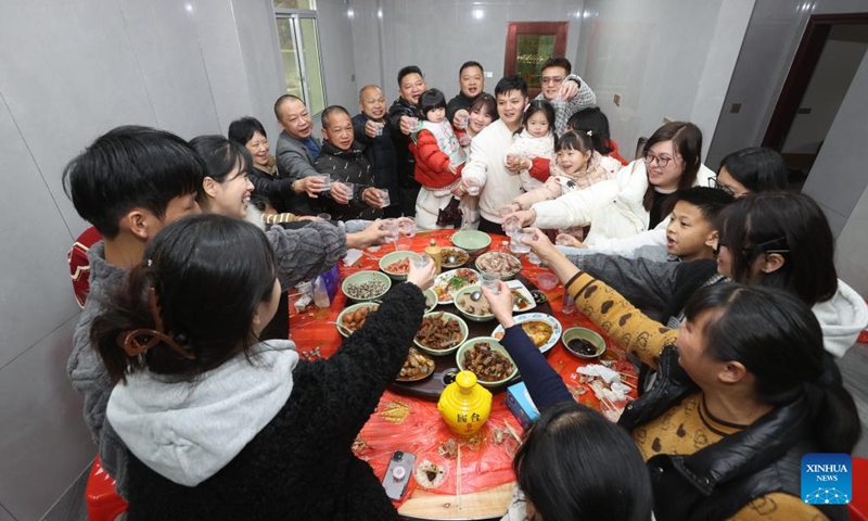 People have a family reunion dinner in Huangtian Village of Yongchun County, Quanzhou, southeast China's Fujian Province, Feb. 9, 2024. People across the country enjoy the festive atmosphere with family reunion dinners on the eve of Chinese Lunar New Year on Friday. Photo: Xinhua