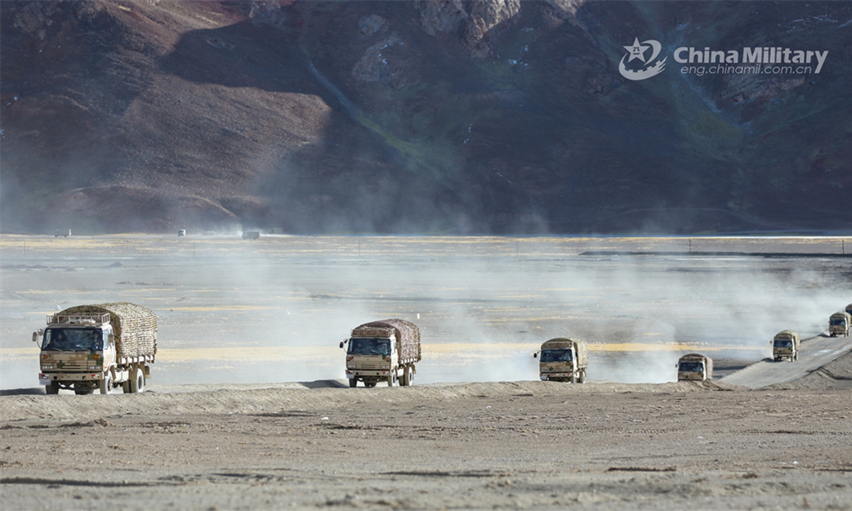 A convoy of military trucks attached to a PLA Army regiment moves on the plateau during the driving skill training in late January, 2024. (eng.chinamil.com.cn/Photo by Yu Zhen Wei)
