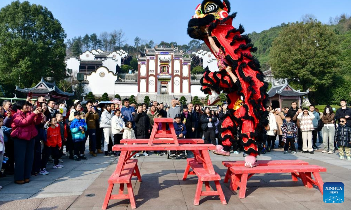 Actors perform lion dance at a cultural scenic spot in Zigui County, central China's Hubei Province, Feb. 13, 2024. People across China are enjoying temple fairs, lantern shows and other events to celebrate the Chinese Lunar New Year and embrace the festive atmosphere. (Photo by Wang Huifu/Xinhua)




