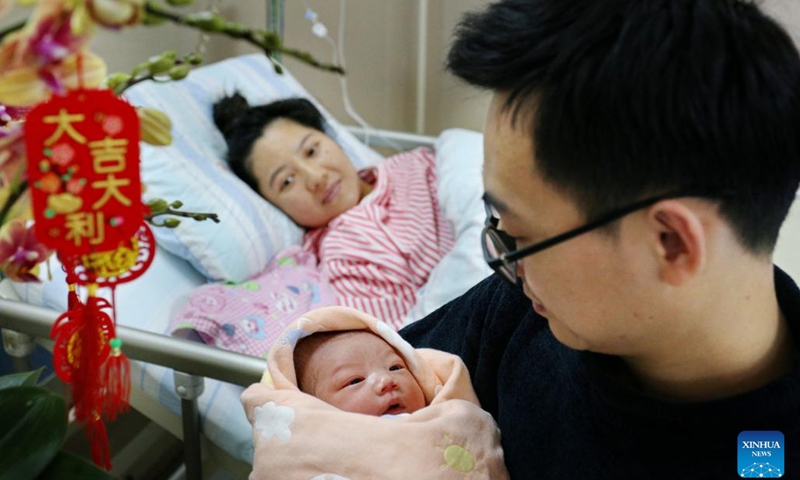 A newborn baby, whose Chinese zodiac sign is dragon, is seen with family members at a hospital in Heshan, south China's Guangdong Province, Feb. 10, 2024. According to the Chinese zodiac and tradition, the Year of Dragon symbolizes courage, auspiciousness and good luck. (Photo: Xinhua)