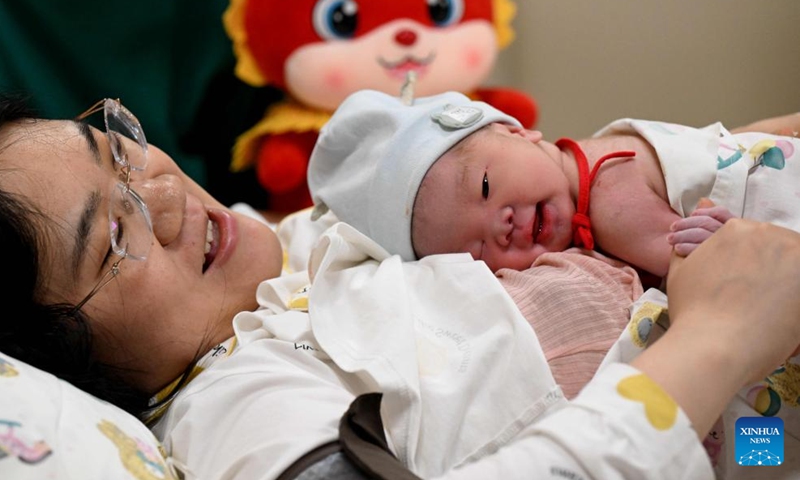 A newborn baby, whose Chinese zodiac sign is dragon, is seen with the mother at a hospital in Shijiazhuang, north China's Hebei Province, Feb. 10, 2024. According to the Chinese zodiac and tradition, the Year of Dragon symbolizes courage, auspiciousness and good luck. (Photo: Xinhua)
