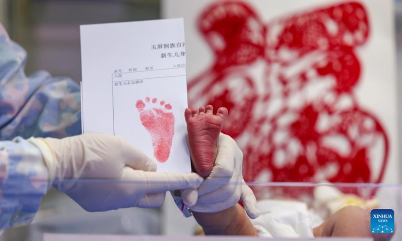 A newborn baby, whose Chinese zodiac sign is dragon, is seen with a footprint at a hospital in Yuping Dong Autonomous County of Tongren City, southwest China's Guizhou Province, Feb. 10, 2024. According to the Chinese zodiac and tradition, the Year of Dragon symbolizes courage, auspiciousness and good luck. (Photo: Xinhua)