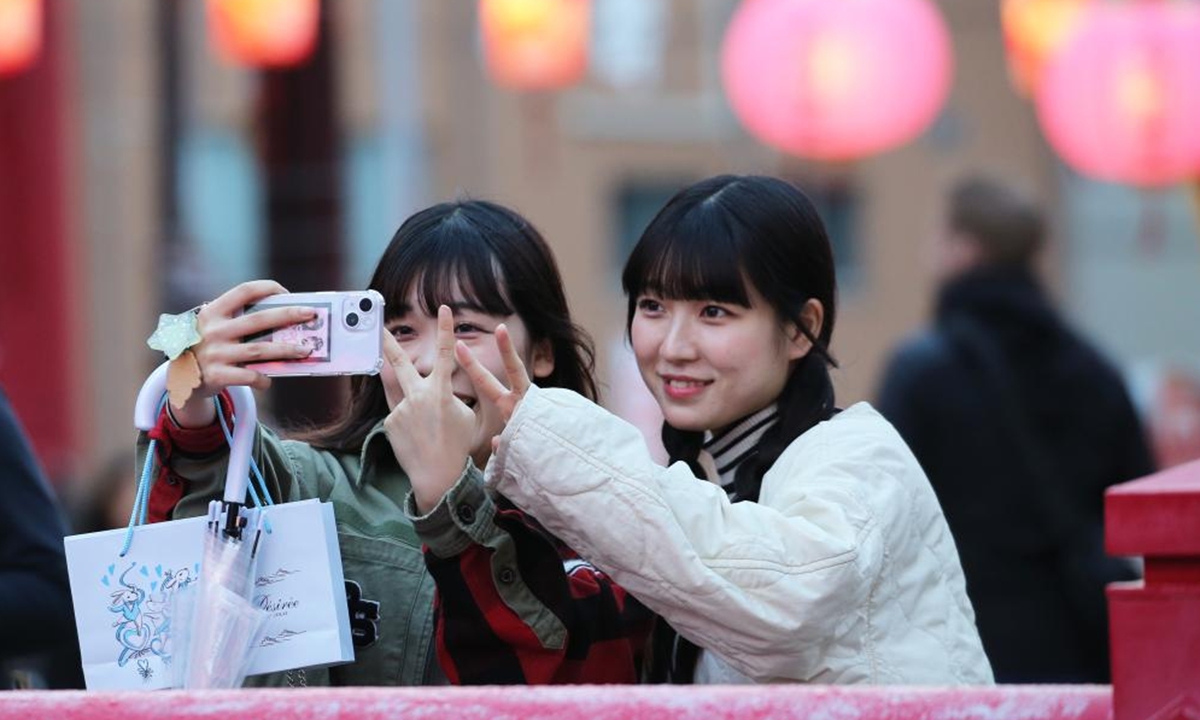 Visitors take photos at a lantern festival celebrating the Chinese New Year in Nagasaki, Japan, Feb. 14, 2024. (Xinhua/Yang Guang)