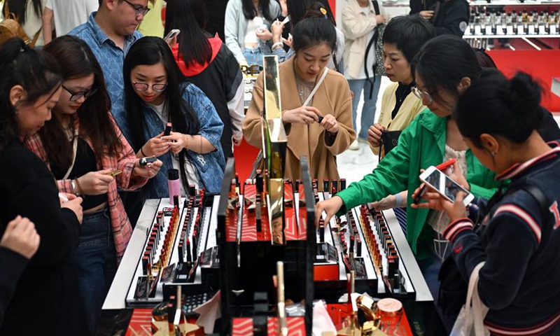 People shop at Haikou International Duty-Free Shopping Complex in Haikou, south China's Hainan Province, Feb. 11, 2024. (Xinhua/Guo Cheng)
