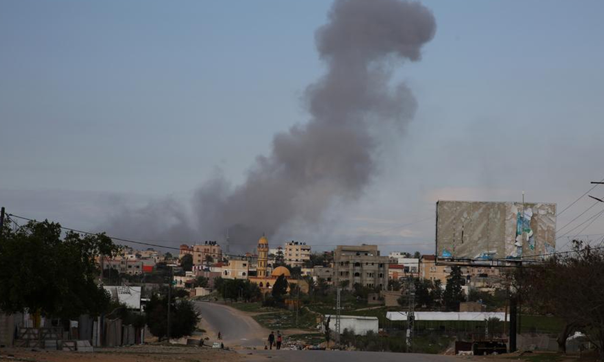 Smoke rises after Israeli bombings in the southern Gaza Strip city of Khan Younis, on Feb. 14, 2024. The Palestinian death toll in the Gaza Strip has risen to 28,576 with 68,291 others wounded since the Israel-Hamas conflict broke out on Oct. 7, 2023, the Hamas-health ministry said in a press statement on Wednesday. (Photo by Khaled Omar/Xinhua)