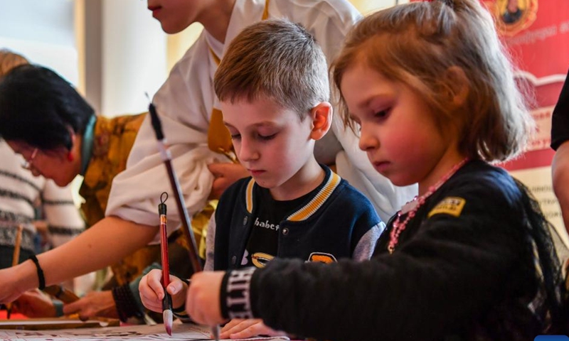 Children try Chinese calligraphy during an event celebrating the Chinese Lunar New Year, or the Spring Festival, in Moscow, Russia, Feb. 11, 2024. (Photo: Xinhua)