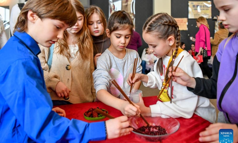 Children learn to use chopsticks during an event celebrating the Chinese Lunar New Year, or the Spring Festival, in Moscow, Russia, Feb. 11, 2024. (Photo: Xinhua)