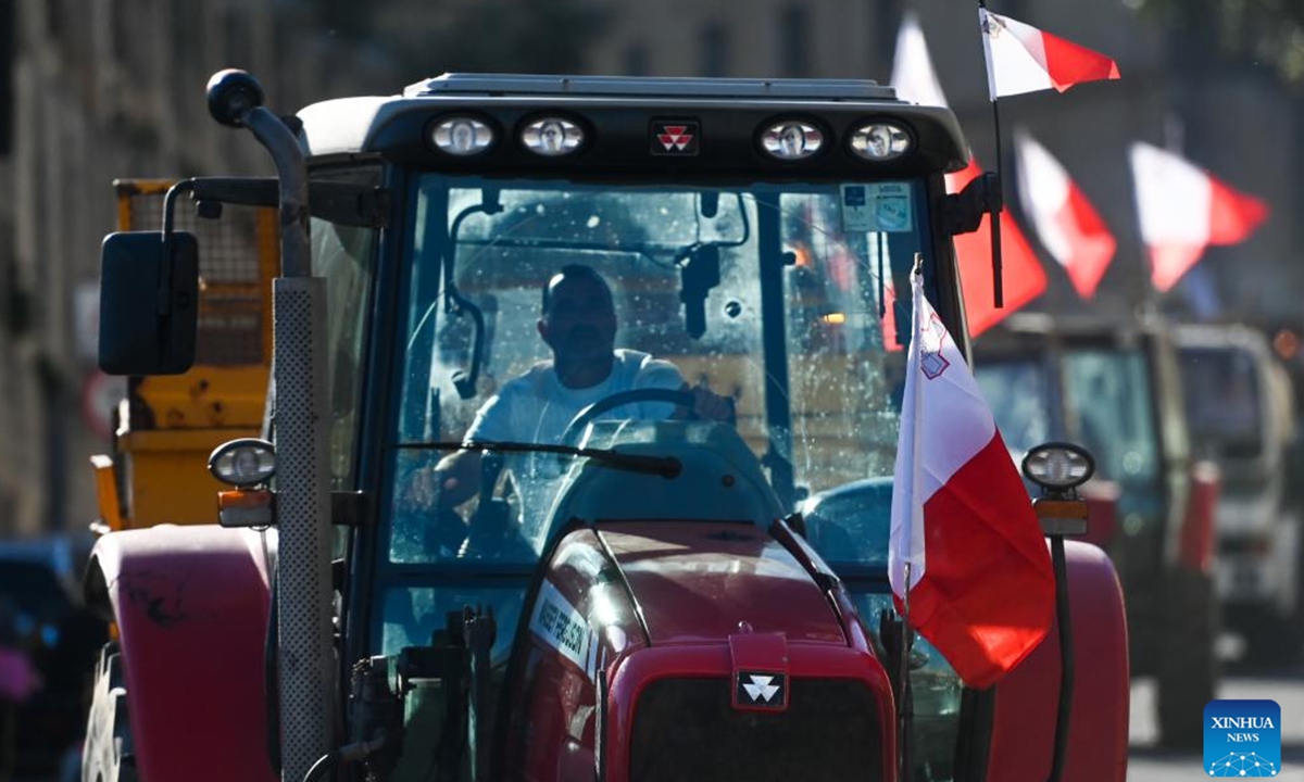 Photo taken on Feb. 15, 2024 shows tractors driving on a road during a farmers' protest in Valletta, Malta. Maltese farmers staged a new wave of protest on Thursday, demanding more economic support from their government and reiterating opposition to some European Union (EU) policies related to agriculture and environment protection. (Photo by Jonathan Borg/Xinhua)