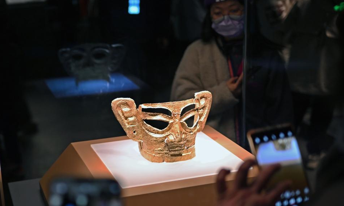 Visitors look at an exhibit during the exhibition of Stars over China: The Ancient Shu Civilization of Sanxingdui and Jinsha in Shanghai Museum, Shanghai, east China, Feb. 15, 2024. (Xinhua/Liu Ying)