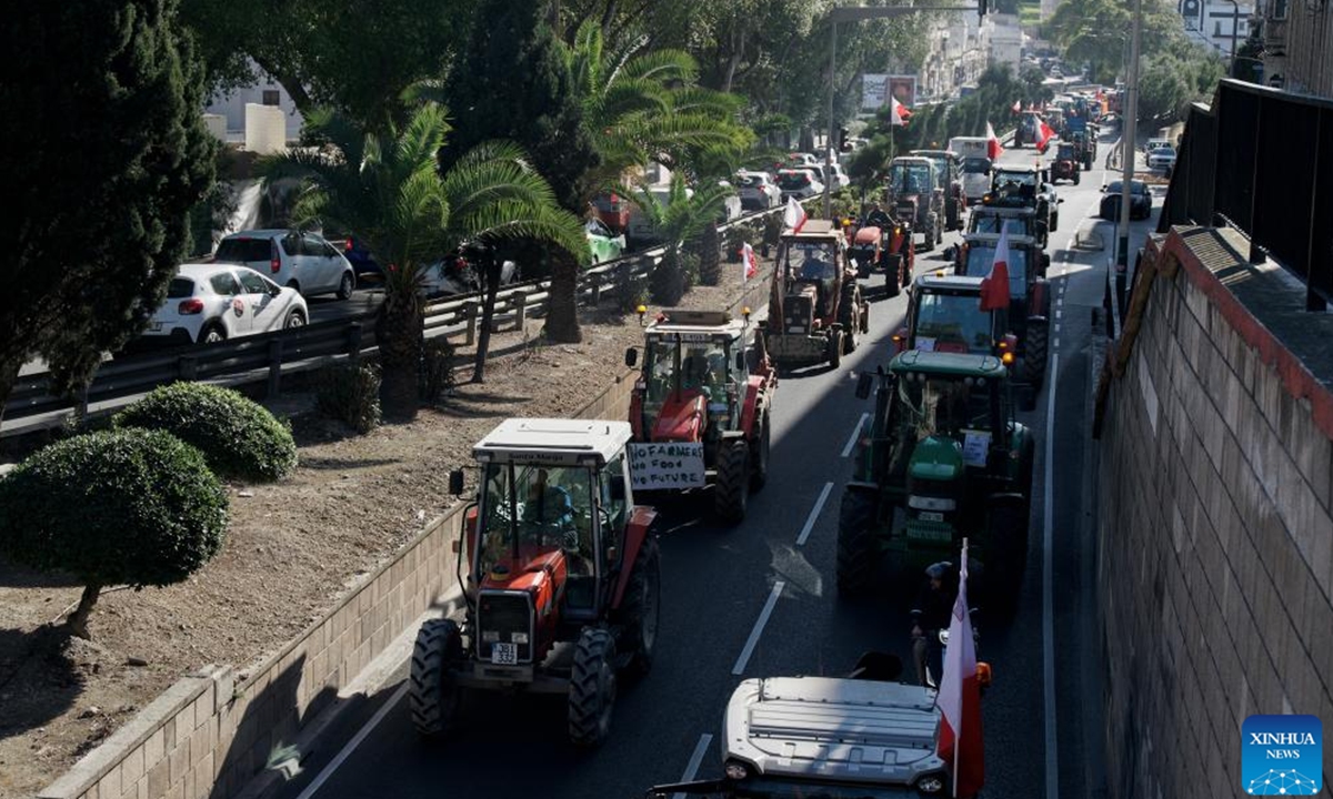 Photo taken on Feb. 15, 2024 shows tractors driving on a road during a farmers' protest in Valletta, Malta. Maltese farmers staged a new wave of protest on Thursday, demanding more economic support from their government and reiterating opposition to some European Union (EU) policies related to agriculture and environment protection. (Photo by Jonathan Borg/Xinhua)